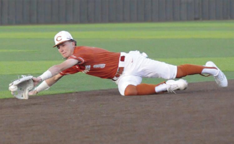 RYAN SEE OF Caldwell lunges for the ball against Taylor. The Hornets won 4-3. -- Tribune photo by Denise Squier