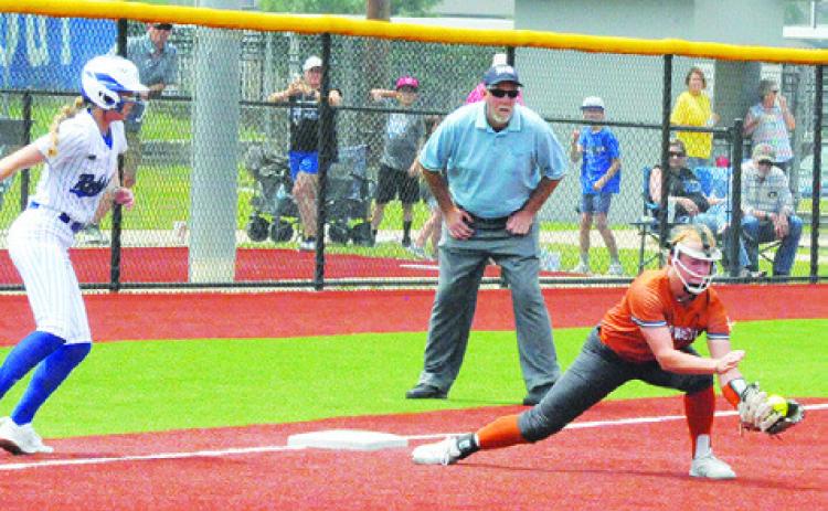 CALDWELL’S CAITLYN FAUST grabs a ground ball to force an out at first base during Game 2 of the Caldwell-Robinson area series on Saturday afternoon at Georgetown High School. -- Tribune photo by Denise Squier