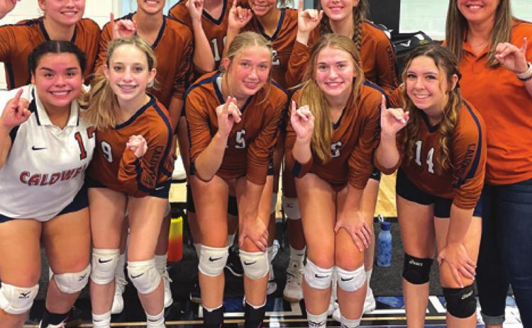 THE CALDWELL LADY HORNET JUNIOR varsity volleyball team celebrates after placing second in the Navasota Junior Varsity Volleyball Tournament over Aug. 27-28.