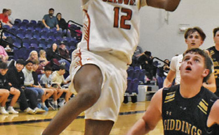 CALDWELL’S JADEN Hagan leaps high for this shot against Giddings last Friday. Tribune photo by Roy Sanders