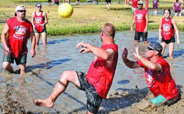 IT’S A FIGHT for the ball last Saturday at Hog Splash 2026 at Slovacek’s, the annual games benefiting Hospice Brazos Valley. Tribune photo by Roy Sanders