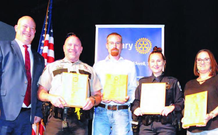 THE CALDWELL ROTARY CLUB HONORED local law enforcement agencies during its annual Law Enforcement Appreciation Banquet last Thursday at the Caldwell Civic Center. Pictured is Rotary President Drew Stackhouse with law enforcement award winners: Deputy Jim Loeblien, Peace Officer of the Year; Deputy Marshall Bengs, “Service Above Self Award” honoree; Officer Lindsey Dekneef, Rookie of the Year; and Pam Kothmann, Support Personnel of the Year Award honoree. -- Tribune photo by Denise Squier