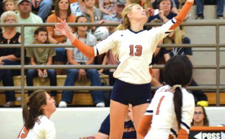 CALDWELL’S MARLEY MAURER pushes the ball over the net during the Lady Hornet’s straight set win over Franklin on Friday night at Hornet Gym. Also pictured are Kaylee Maurer and Aaliyah Massingill. Caldwell also beat Sealy on Tuesday, Aug. 20, and was 4-1 at the Robinson Tournament, with a second place finish, last week to improve to 22-3 for the season and rank Number 5 in Class 4A in the latest Texas Girls Coaches Association Poll. -- Tribune photo by Denise Hornaday