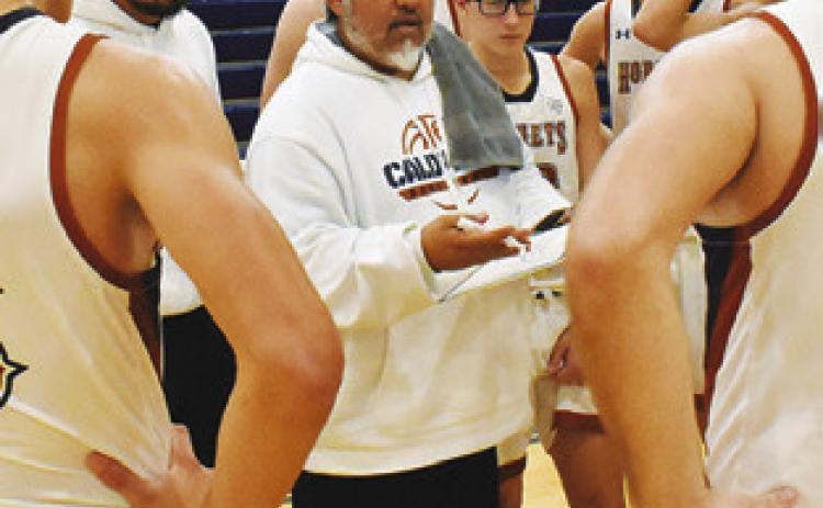 RENE CANTU, Caldwell’s new head coach, talks to players during a timeout against Somerville. Tribune photo by Roy Sanders