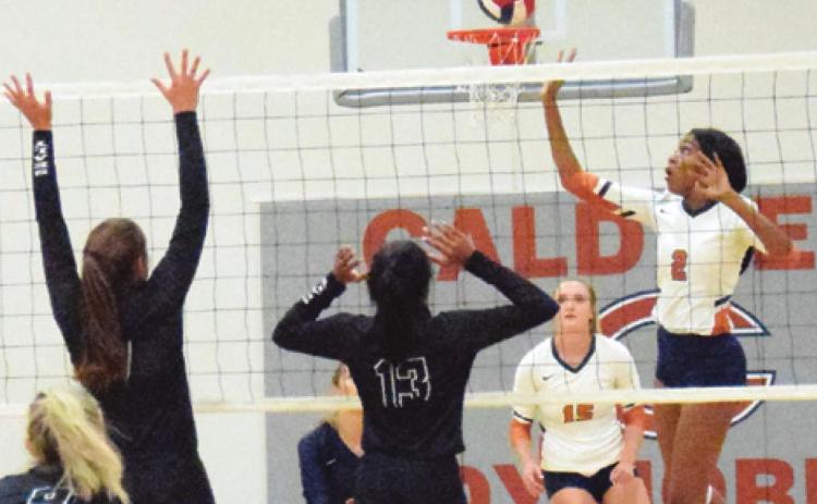 CALDWELL’S AALIYAH MASSINGILL taps the ball over the net during the Lady Hornets’ five-set battle against Sealy last Tuesday night. -- Tribune photo by Miranda Jones