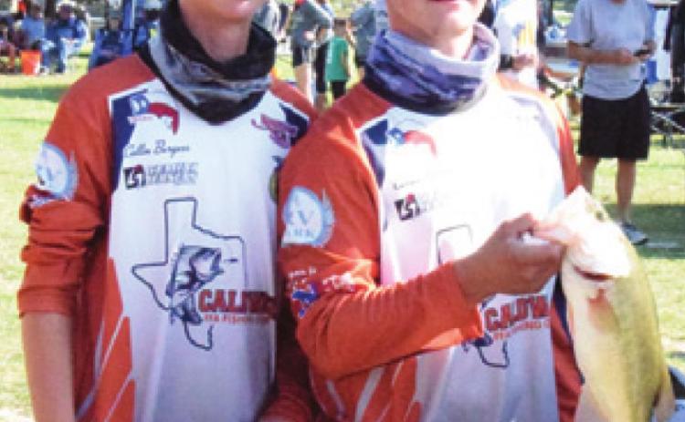COLLIN BURGESS and Carson Parker hold a fish they caught at a Texas High School Bass Association tournament held at Lake Somerville. -- Tribune photo by Denise Hornaday