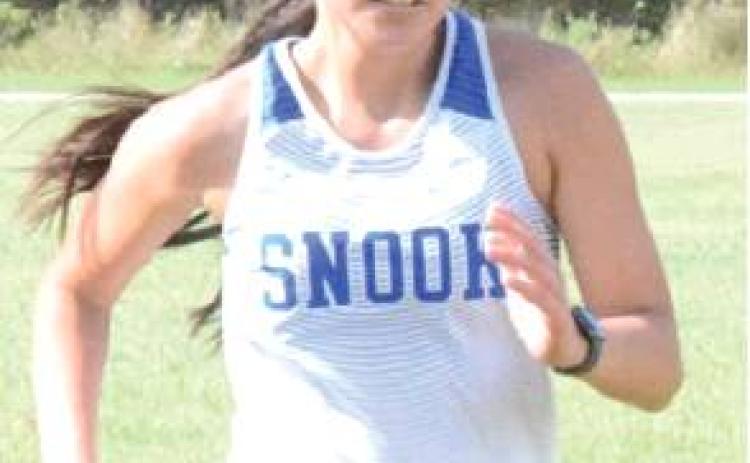 Nino of Snook placed fifth in the District 26-2A girls’ varsity cross country race on Thursday in Caldwell.