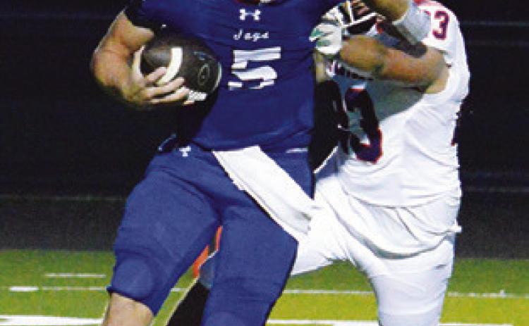 BRAYDEN MACIK carries the ball for Snook against St. Stephen’s last Friday in Snook. Tribune photo by Kim Hutcheson