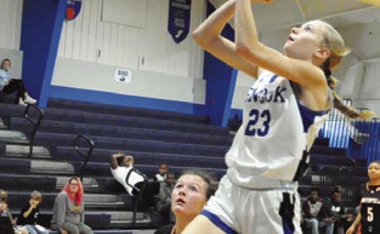 DAKOTA KIENOW PREPARES to take a shot during the Snook-Smithville game last Tuesday afternoon in Snook. Tribune photo by Denise Squier