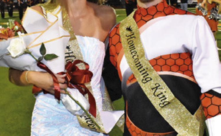 CALDWELL HIGH School Homecoming Queen Lucy Ferguson and King Grant Leubner are crowned on Friday at the game.
