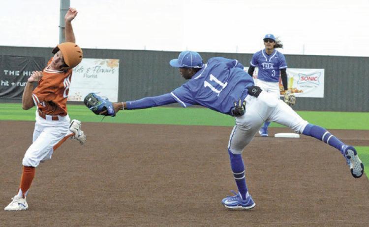 DANIEL BARDIN OF Caldwell avoids this tag at third base last Saturday in the 13-0 home victory over Manor New Tech. -- Tribune photo by Denise Squier