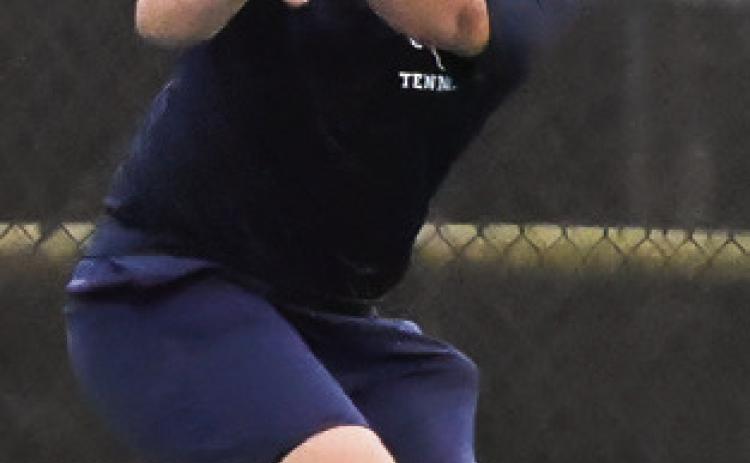 FELIPE GAUCIN eyes his shot during a district match earlier in the team tennis season at the Caldwell High School tennis courts. Tribune photo by Denise Squier