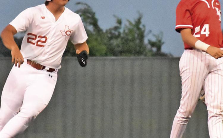 CALDWELL’S CASON RUSS runs to second base against Bellville. Tribune photo by Roy Sanders