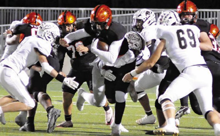 JA’ KEITH DANIELS RUNS for some tough yardage against Junction in Friday’s third round playoff game in Pflugerville. Tribune photo by Denise Squier