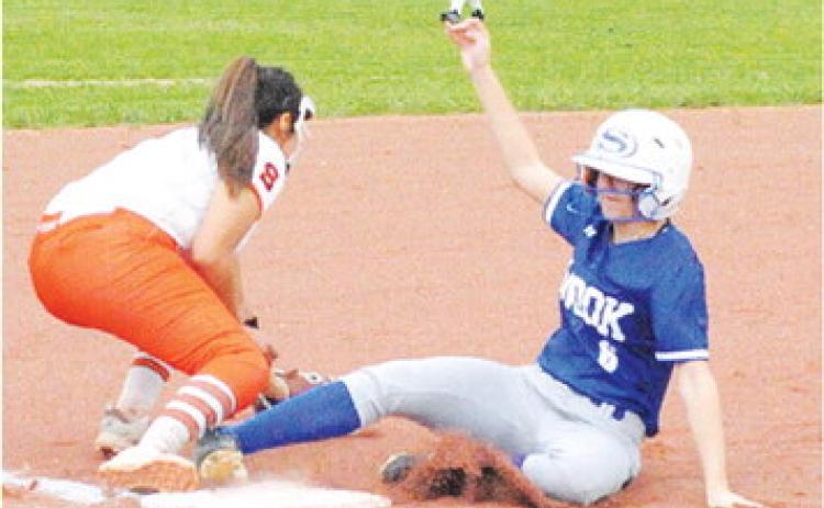 SNOOK’S TAYLOR GROCE slides safely into third base during the Snook-Somerville game last Friday night. -- Tribune photo by Denise Squier