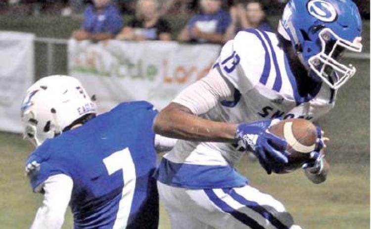 JERMAINE KEARNEY HAULS in this touchdown pass last Friday against Brazos Christian School in Bryan. Snook lost 48-38 and hosts Texas Wind this Friday in their homecoming game.