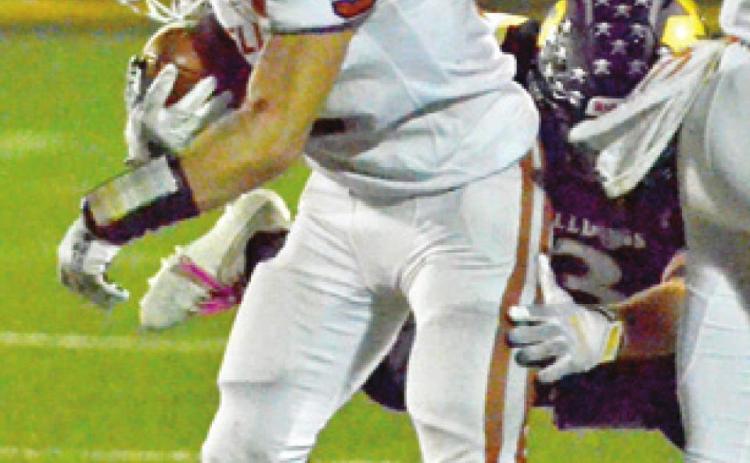 CALDWELL’S JACE ALY carries the ball against McGregor in the Hornets’ final game in McGregor. Caldwell lost 53-14.