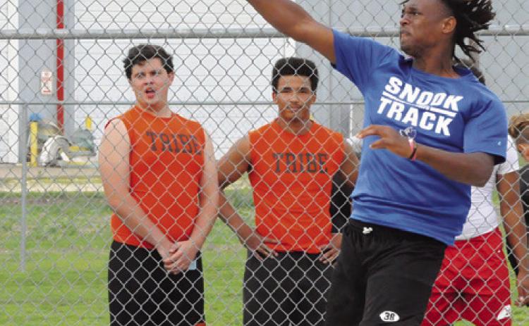 SNOOK’S JEREMIAH POWELL hurls the discus during the District 26-2A Track Meet in Snook last week. He placed fifth. Tribune photo by Denise Squier