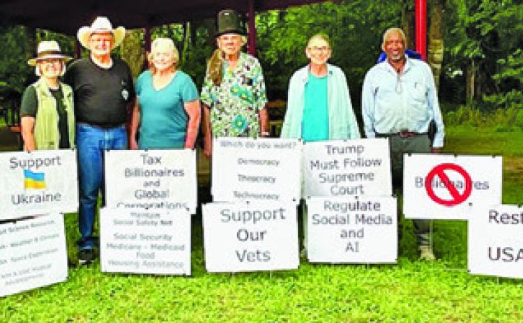 THESE 17 SIGNS WERE on display in Davidson Creek Park during Sunday’s ice cream social, sponsored by the Burleson County Democrats.