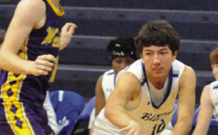 BRAEDYN FANNIN passes the ball against Weimar. Snook won 52-35. Tribune photo by Denise Squier