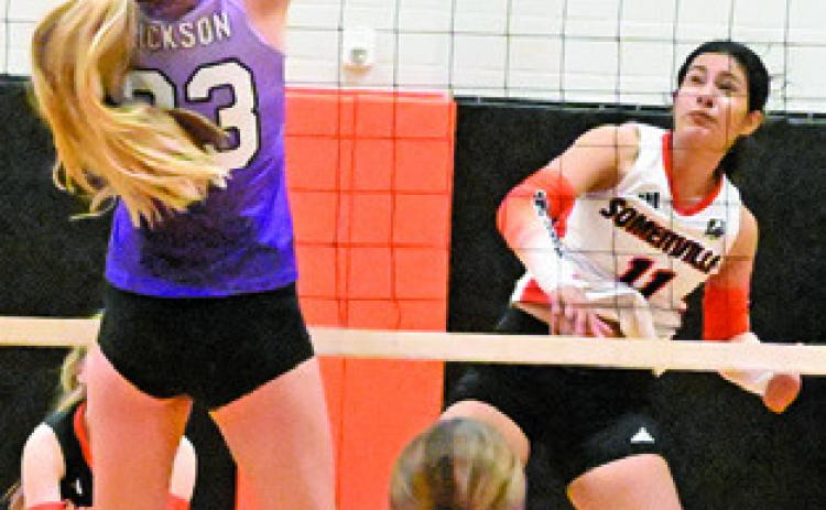 ANETTE REYNA gets a kill during Somerville’s match against Aggieland HomeSchool last Friday in Somerville. Tribune photo by Denise Squier