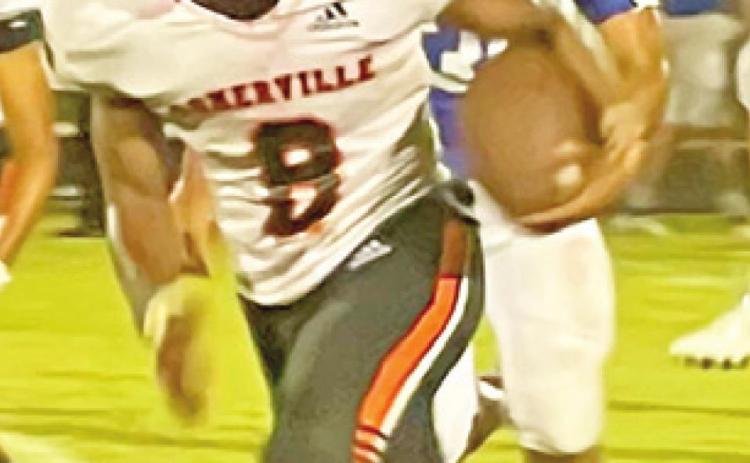 DEVEN GREEN of the Somerville Yeguas breaks away from this Hempstead defender last Friday. -- Photo by Ursula Idlebird.