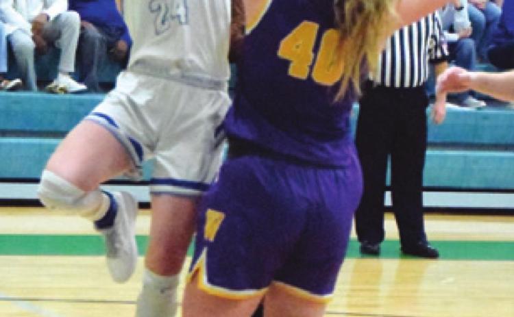 JAYCIE BRISCO shoots over Weimar’s Kennedy Koehn in the Lady Jays’ regional quarterfinal win. -- Tribune photo by Denise Squier