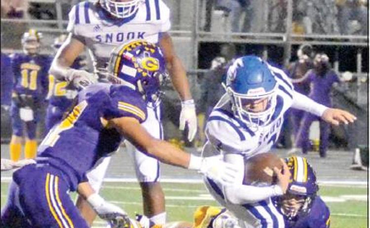 DAVID DAVILA FIGHTS for extra yardage against Granger last Friday in Rockdale. The Bluejays lost 36-12 in the bi-district playoff to finish the season at 4-7. -- Tribune photo by Roy Sanders