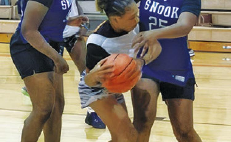 SNOOK JUNIOR High School and Snook High School girls took on Somerville last week at the Somerville High School Gym.