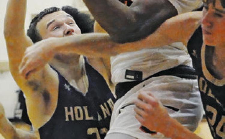 JA’KEITH DANIELS takes a shot against Holland. The Yeguas won 64-15. Tribune photo by Denise Squier