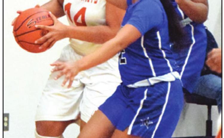 AALAYIAH JONES looks to shoot the ball during Caldwell’s home game against Navasota. Jones was the team’s top scorer with eight points. -- Tribune photo by Denise Hornaday