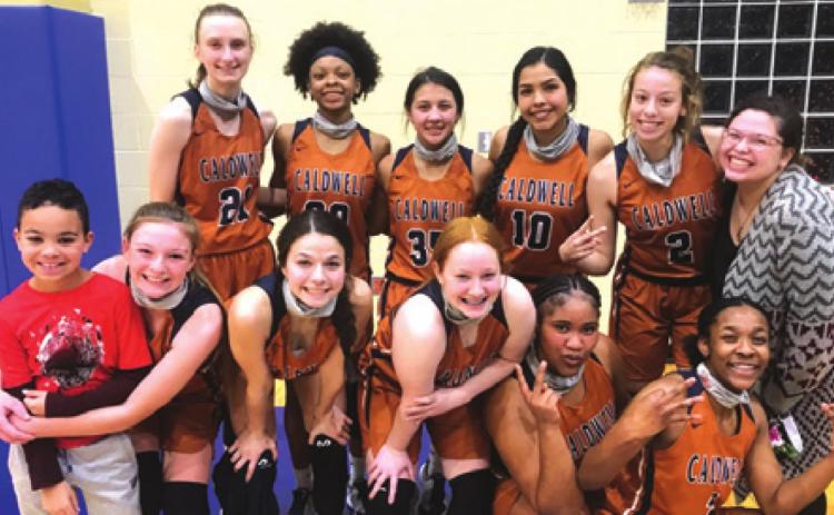 THE LADY HORNETS CELEBRATE after getting their first district win of the season, beating Rockdale 47-37 last Tuesday in Rockdale.