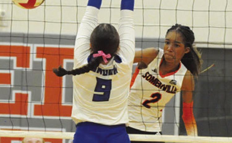 KARYS ELLIS gets a kill past Kalyn Cooper during the Somerville-Snook play-in match for play-off seeding on Monday in Caldwell.