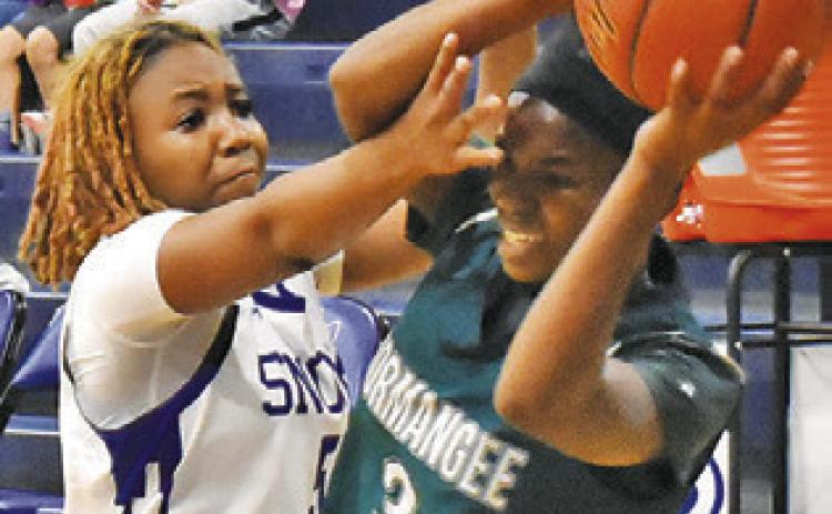 BRAYNIJA POOL DEFENDS the pass during the Snook-Normangee game last Friday. Tribune photo by Roy Sanders