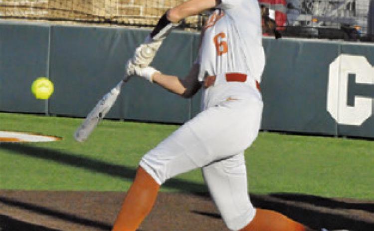 KYSEN TONEY hits the ball during the Lady Hornets big 19-0 win over Manor Net Tech last week. -- Tribune photo by Denise Squier