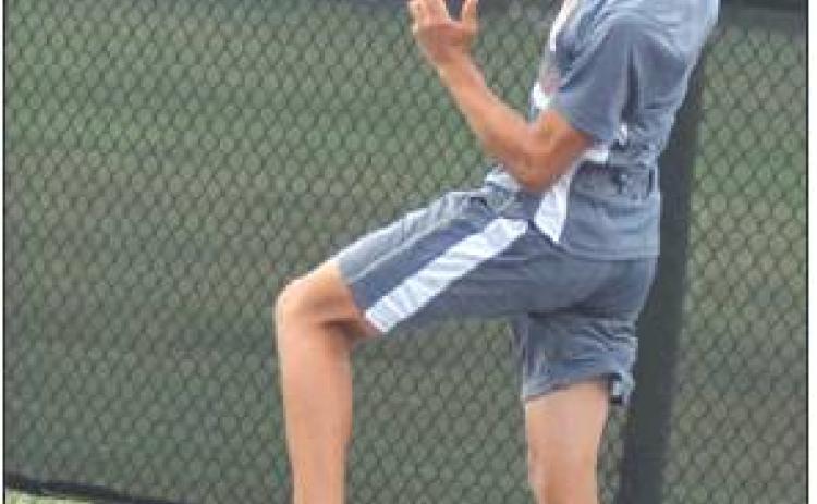ADOLFO GAUCIN hits the ball from behind the backline during Caldwell’s win over Cameron. -- Tribune photo by Denise Hornaday