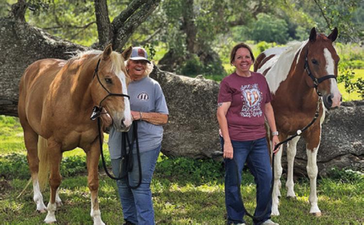 LEE ANN GALLAGHER OF Caldwell, left, with her horse Peppys Golden Playboy, and Elicia Rogers of Atkins, right, with Heza Hugable Jet, owned by Sabine Lazo, both earned top placings in the OHSA Virtual World Show. Tribune photo by Sabine Lazo