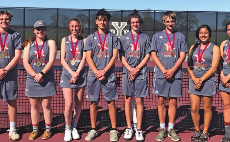 THE CALDWELL VARSITY TENNIS team competed at the Cameron Yoe Tennis Tournament, earning several medals. Pictured, from left, Luke Chapman, Neva Cravens, Autom Chaplin, Nico Lucero, Hayden Cirilo, Waylon Chapman, Aletza Torres and Skylinn Johnson.