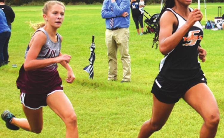 SOMERVILLE’S RA’MAYA CARTER pushes herself to finish seventh in the varsity girls’ division at the District 26-2A Cross Country Meet and qualify for the regional meet. -- Tribune photo by Roy Sanders