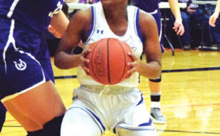 JAIVAN STRINGFELLOW looks to shoot during Snook’s area playoff loss to Mason on Friday. -- Tribune photo by Denise Hornaday