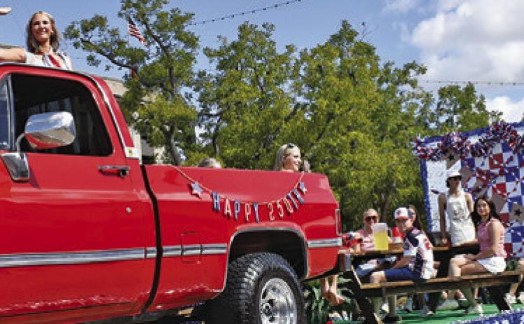 JOLEE TELSCHOW, BURLESON County Fair Queen, rides in her float on Saturday morning at the Burleson County Fair Parade. Tribune photo by Roy Sanders