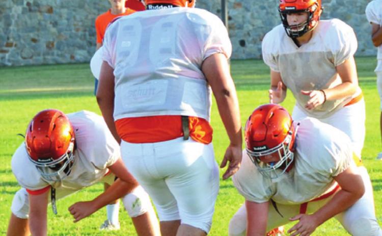 SOMERVILLE QUARTERBACK LORENZO Vega prepares for the snap as linemen Ross Dubois and Riley Eldridge get ready to block. Alejandro Espinoza is on defense. -- Tribune photo by Roy Sanders