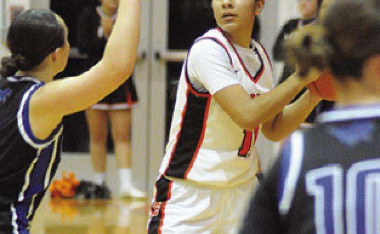 ANETTE REYNA looks for help from a teammate during the Somerville-Mumford game last Friday night at the Yegua Gym. Tribune photo by Denise Squier