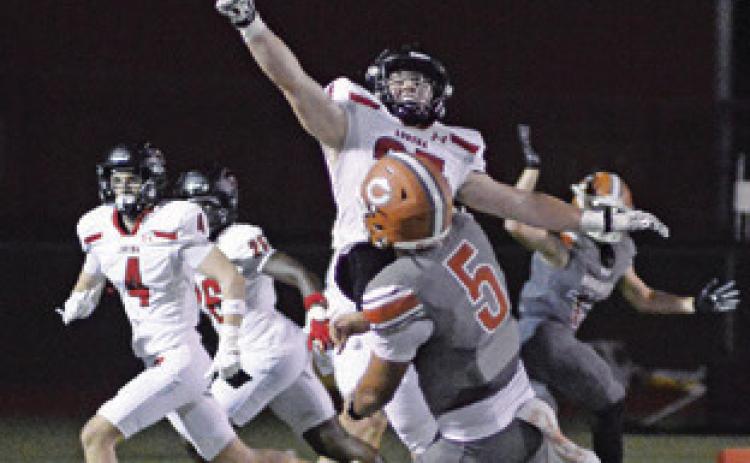 CALDWELL’S JOHN FRYREAR hurls this pass against the Lorena defense last Friday in the district opener in Caldwell. Tribune photo by Kim Hutcheson