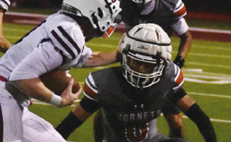 ROGELIO HERNANDEZ of Caldwell moves in for a tackle against Troy. Tribune photo by Roy Sanders