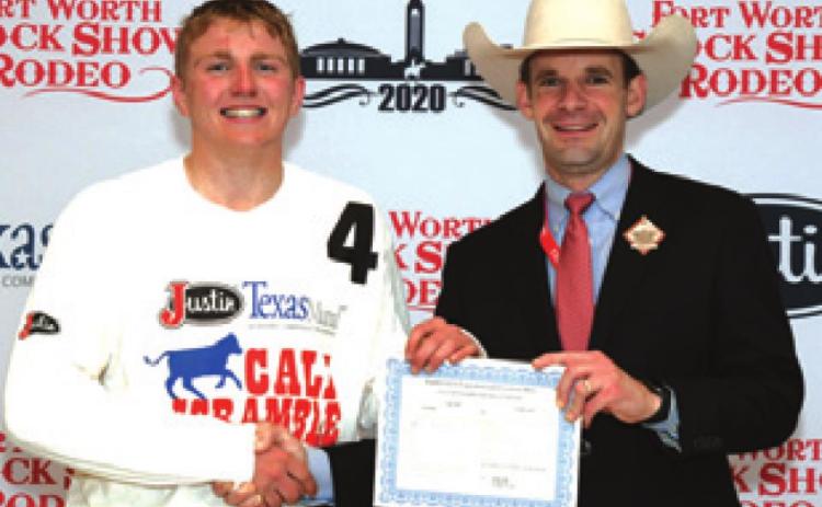 LARAMIE PIEPER won a $500 purchase certificate toward a heifer for exhibition at next year’s Fort Worth Stock Show &amp; Rodeo. He is pictured with Stock Show Calf Scramble Committee Chairman, Paxton Motheral.