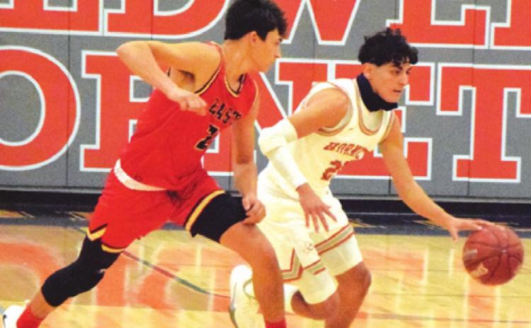 IAN RECIO DRIBBLES the ball for Caldwell against Victoria East.