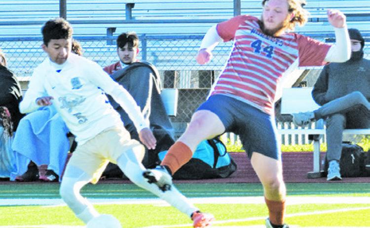CALDWELL’S ERLING CASCO fights for possession of the ball during the Caldwell-Rockdale district game last Friday. -- Tribune photo by Roy Sanders