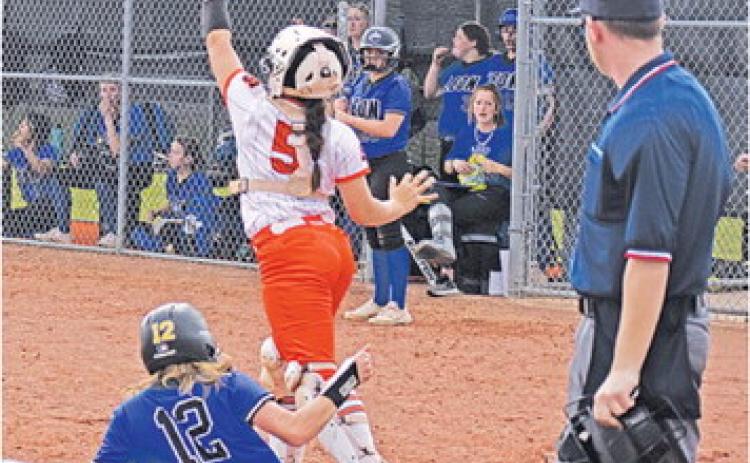 SOMERVILLE’S AVERIE HERNANDEZ catches the ball while a Leon runner slides into home plate last Friday during the Somerville-Leon bi-district game.