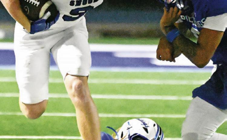 WYATT LOPEZ OF Snook carries the ball against Bartlett. Tribune photo by Denise Squier